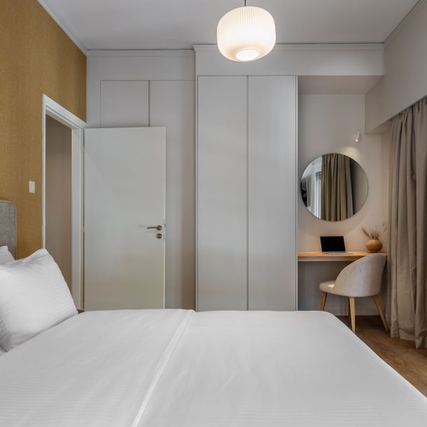 beehive apartments kipseli athens master bedroom with balcony view