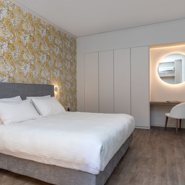 beehive apartments kipseli athens master bedroom with desk area