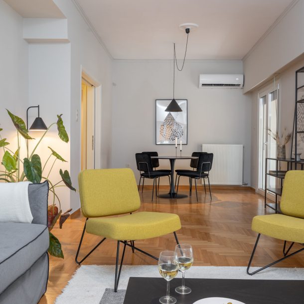 beehive apartments kipseli athens lounge area with dining area